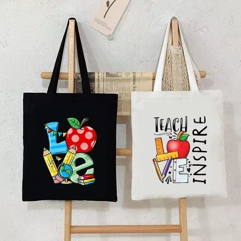 女性キャンバスショルダーバッグティーチラブインスパイアプリン - Tote Bag Canvas Print のレビューと価格